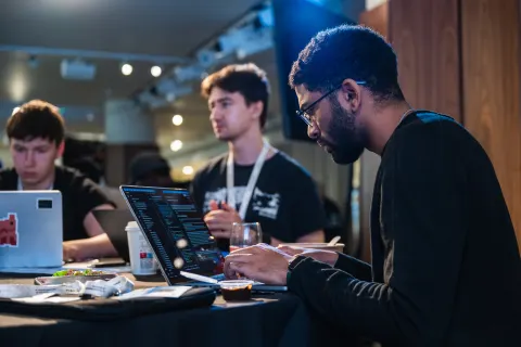 Participants working on AI agents at the London AI Hackathon.