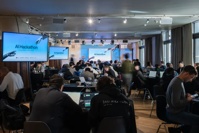 Participants working on AI agents at the London AI Hackathon.
