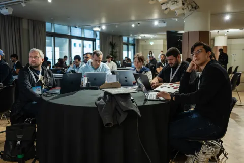Participants working on AI agents at the London AI Hackathon.