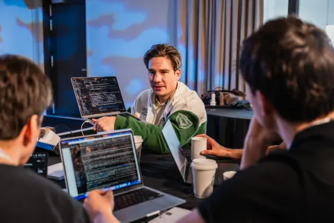 Participants working on AI agents at the London AI Hackathon.