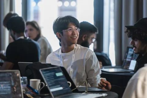 Participants working on AI agents at the London AI Hackathon.